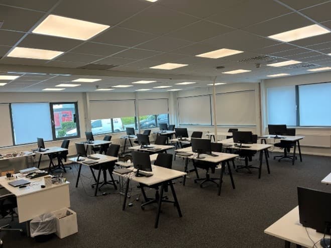 classroom set up with computer screens